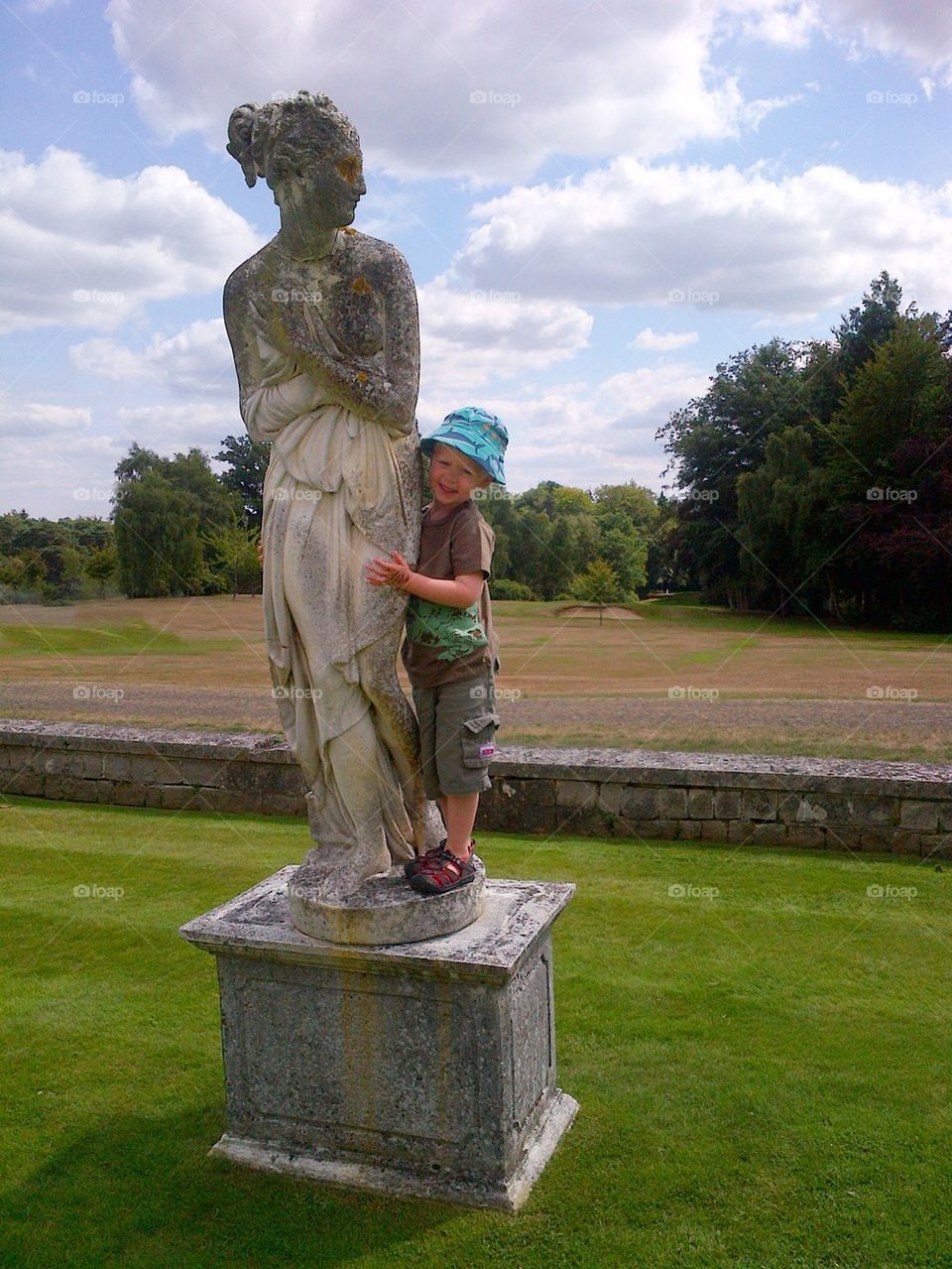 Young boy enjoying a sunny afternoon in Surrey, England.