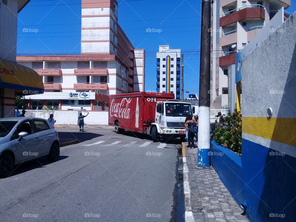 Coca Cola truck. Parking , in a small  street
