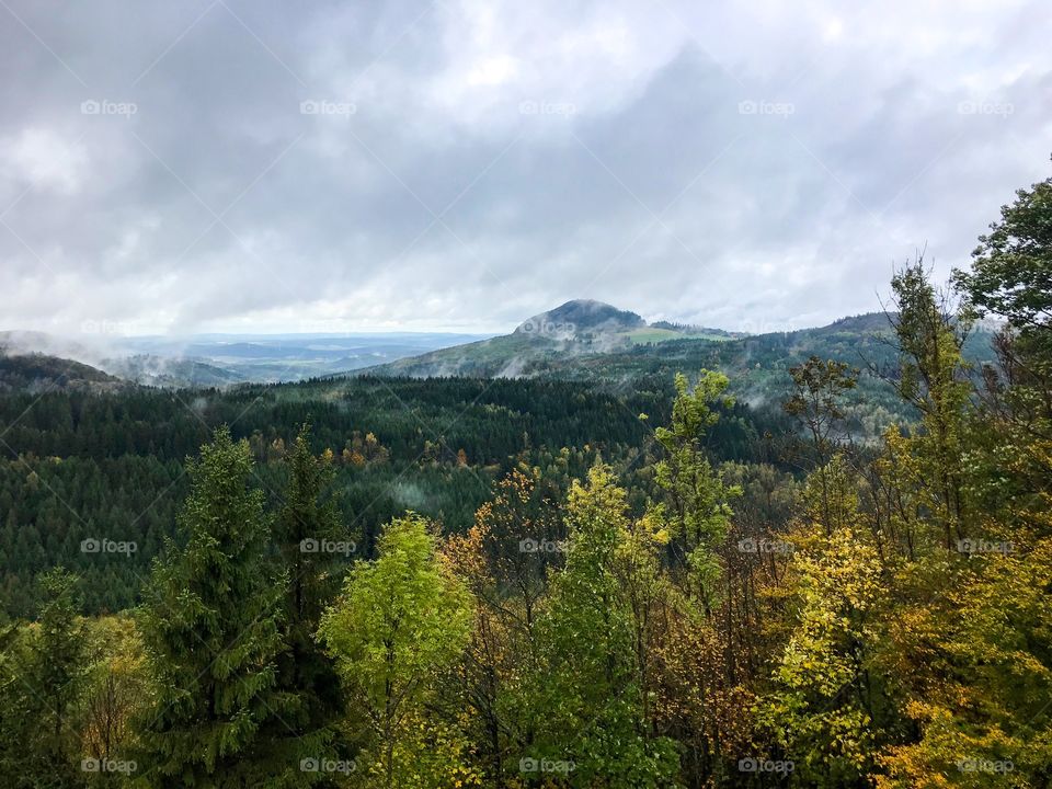 wonderful natural scenery , colorful forests, mountains looming in clouds, cloudy sky with no sunlight, cold and wet air. But hike tour is also great