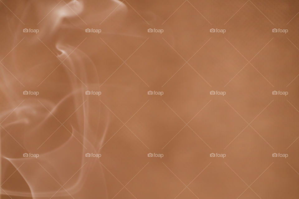 Smoke scented candles on a black background