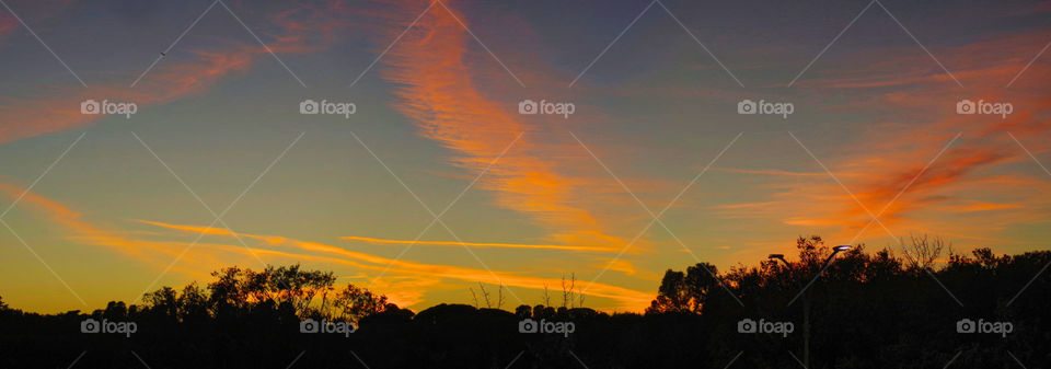 orange sunset with few clouds