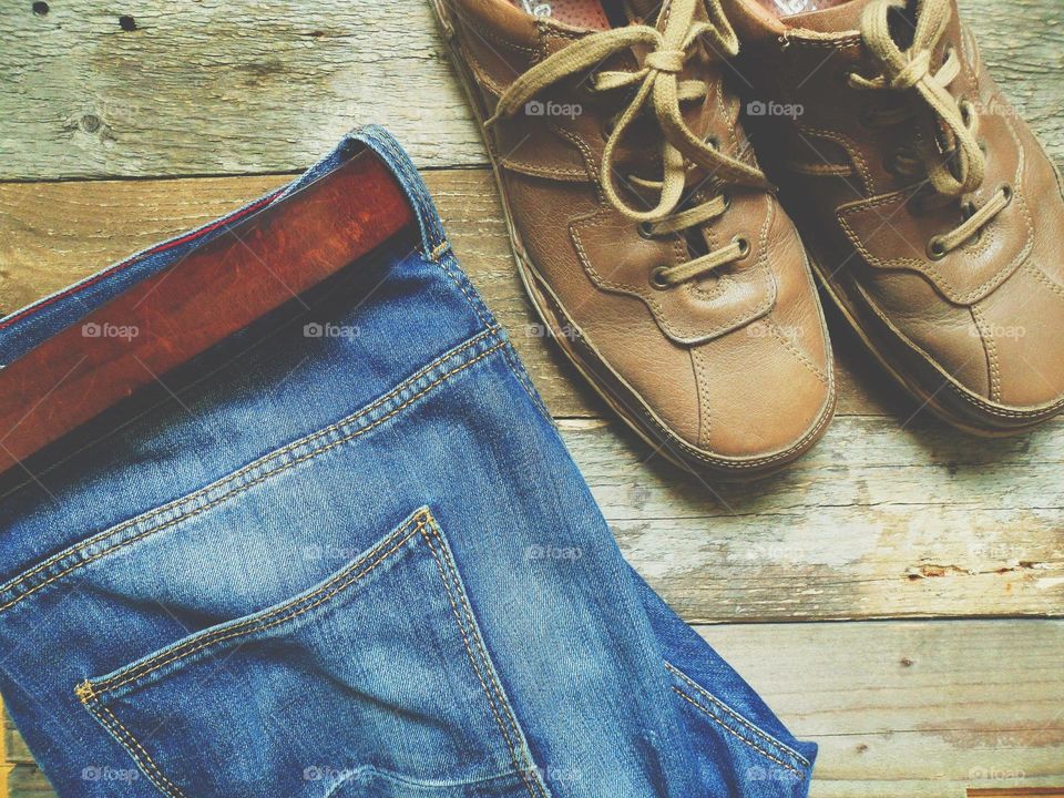 men's leather shoes, blue jeans with a belt