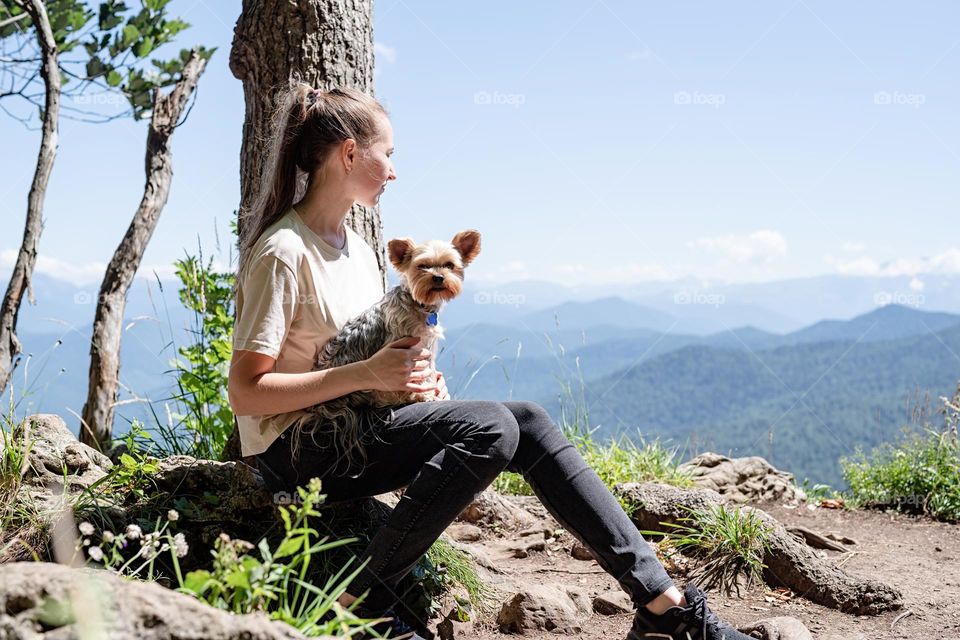 woman and her dog in mountains