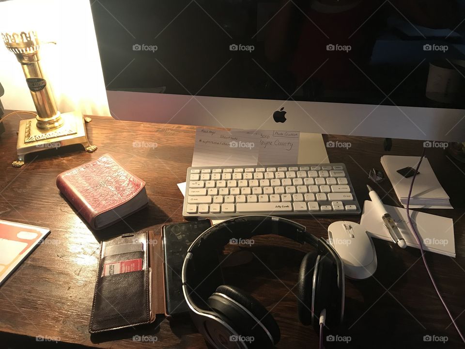 Busy day at the desk, working on the computer. 