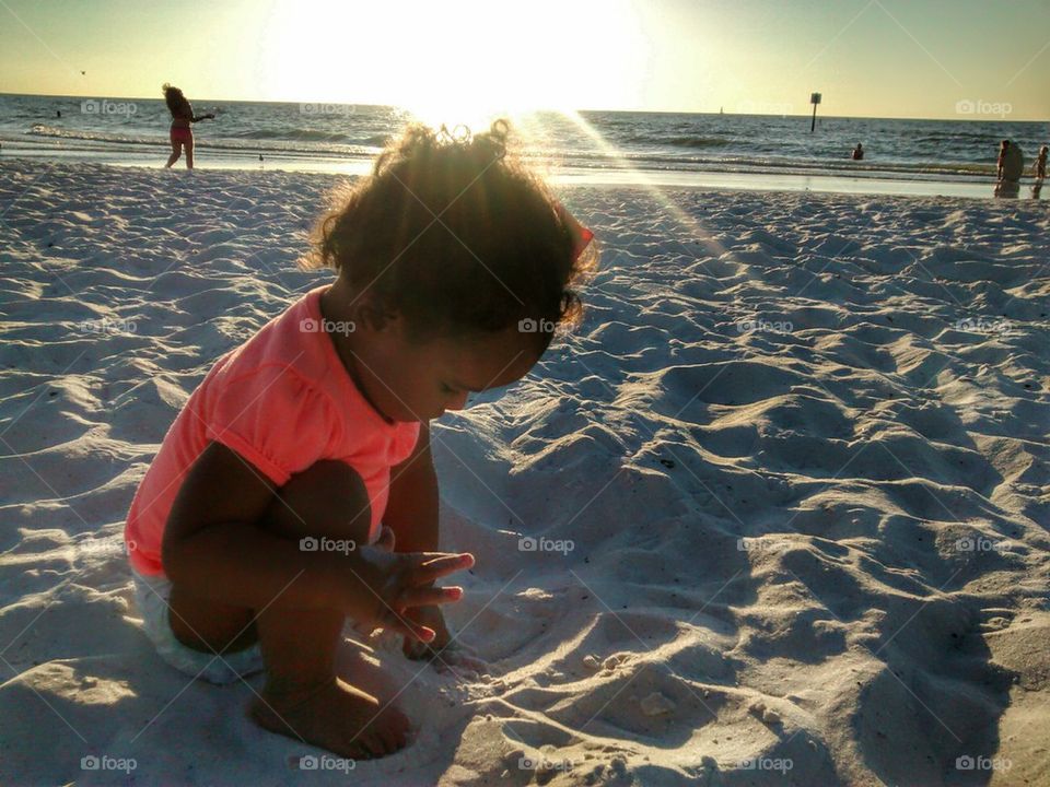 Baby playing with sand
