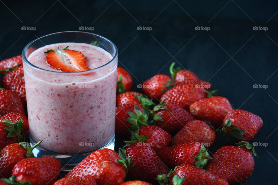Strawberry smoothie. Strawberry smoothie on dark background