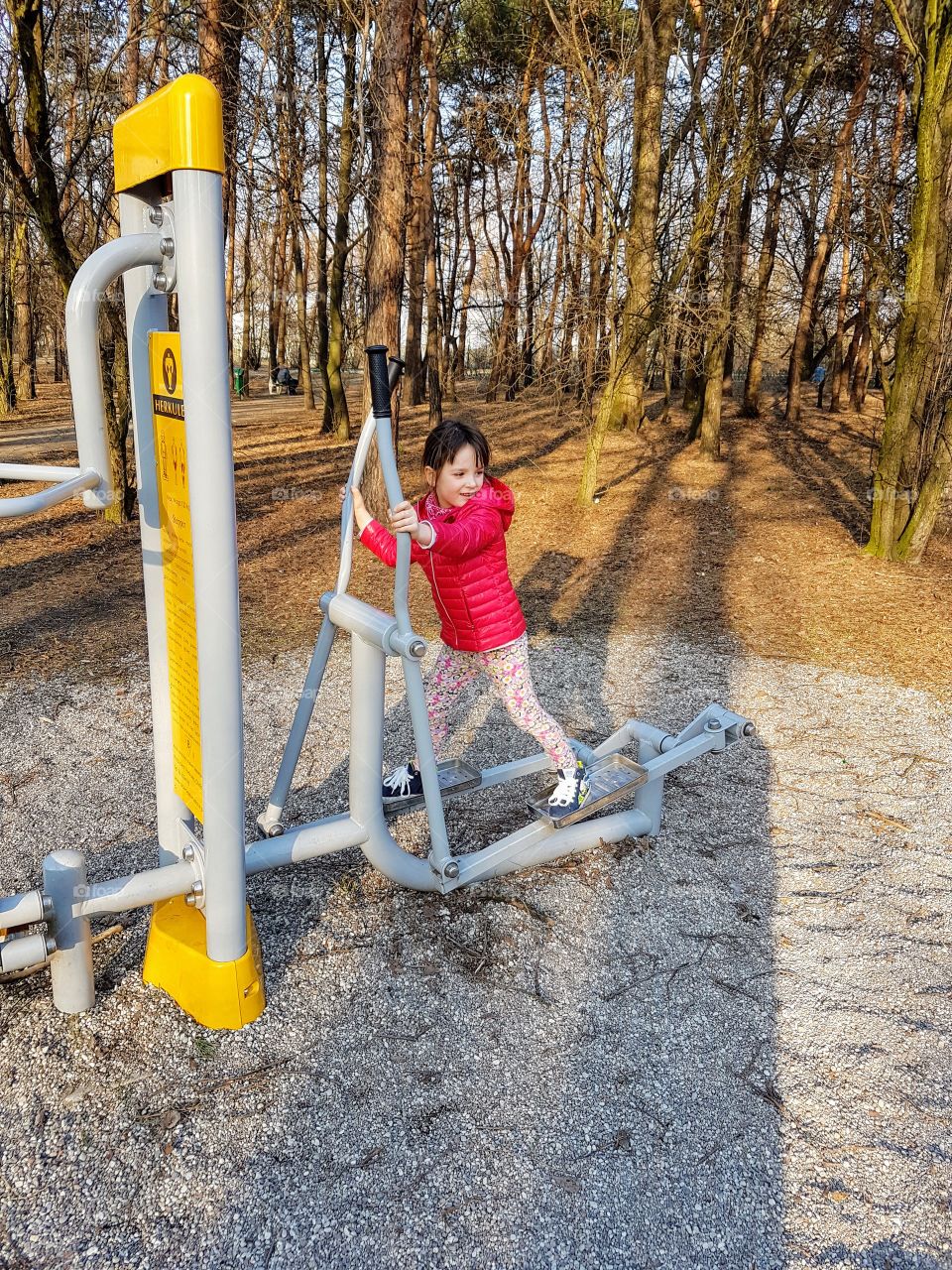 
Little girl exercising outside 