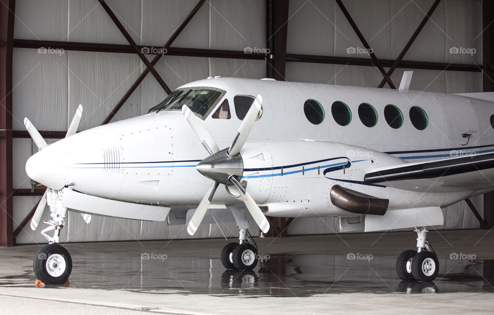 Twin Engine Prop Plane In A Hangar