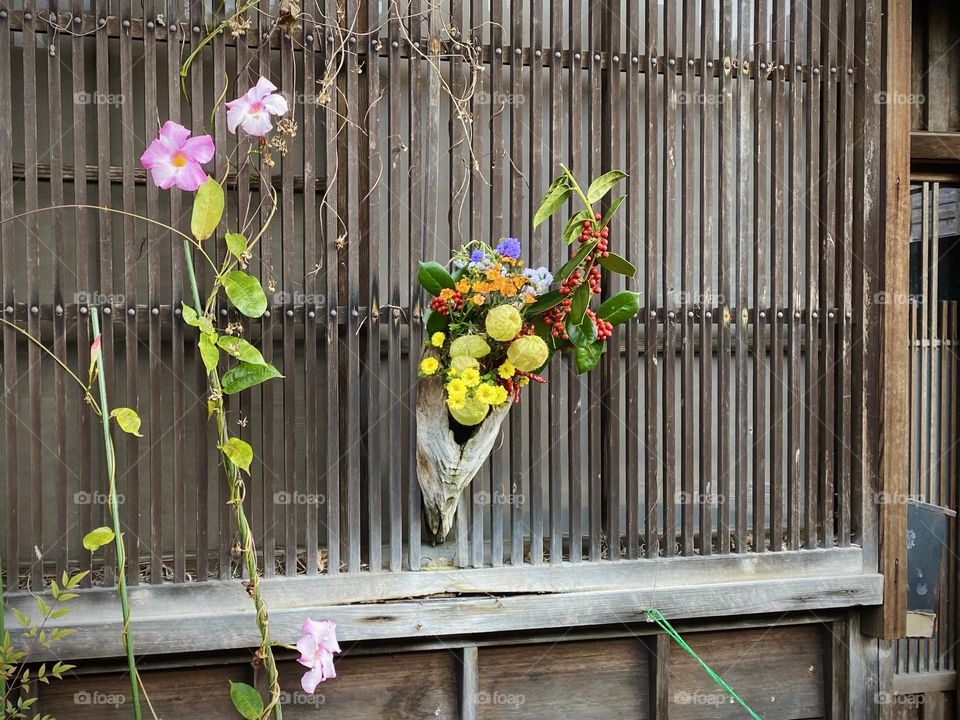 Bouquet decorated on a wooden window of a private house