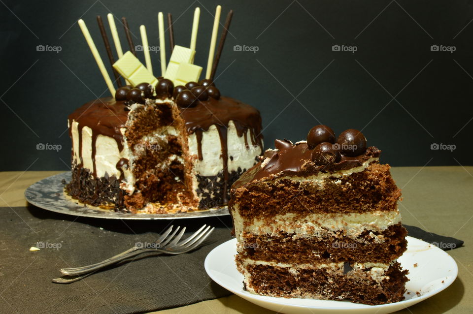 Large slice of chocolate drip cake