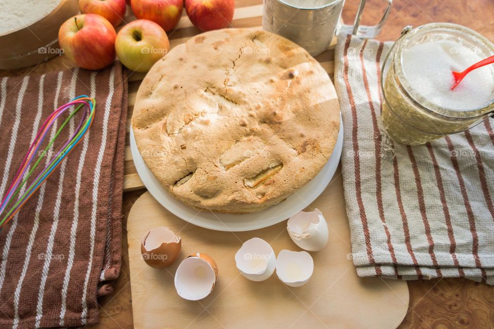 Making homemade puffed apple pie with eggs, sugar and flour.