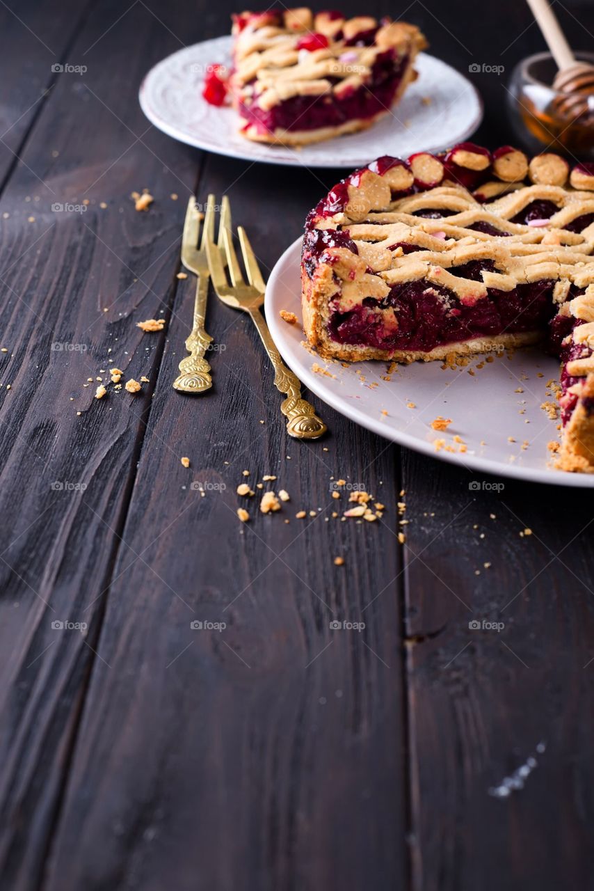 Cherry pie on a  wooden background 