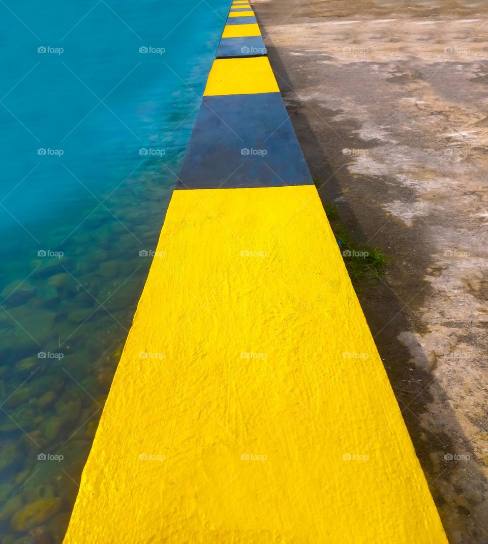 Wall separating land and sea