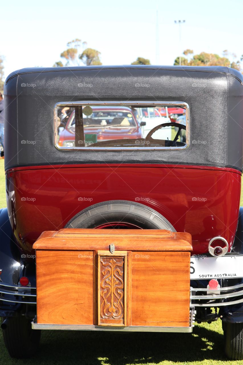 Model T Ford classic car wood boot trunk at outdoor classic and antique car show view of rear of vehicle 