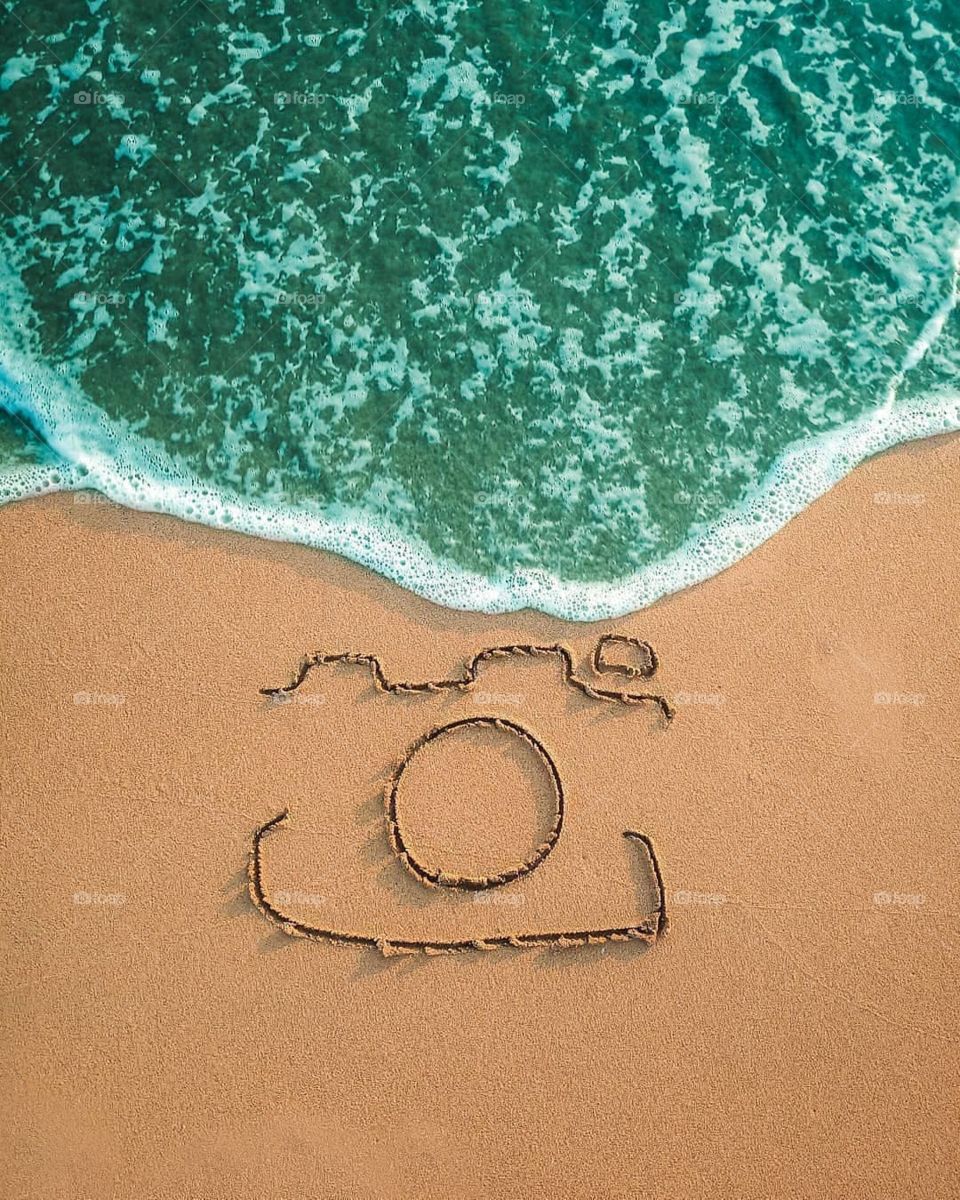 Drawing on the sand of the sea