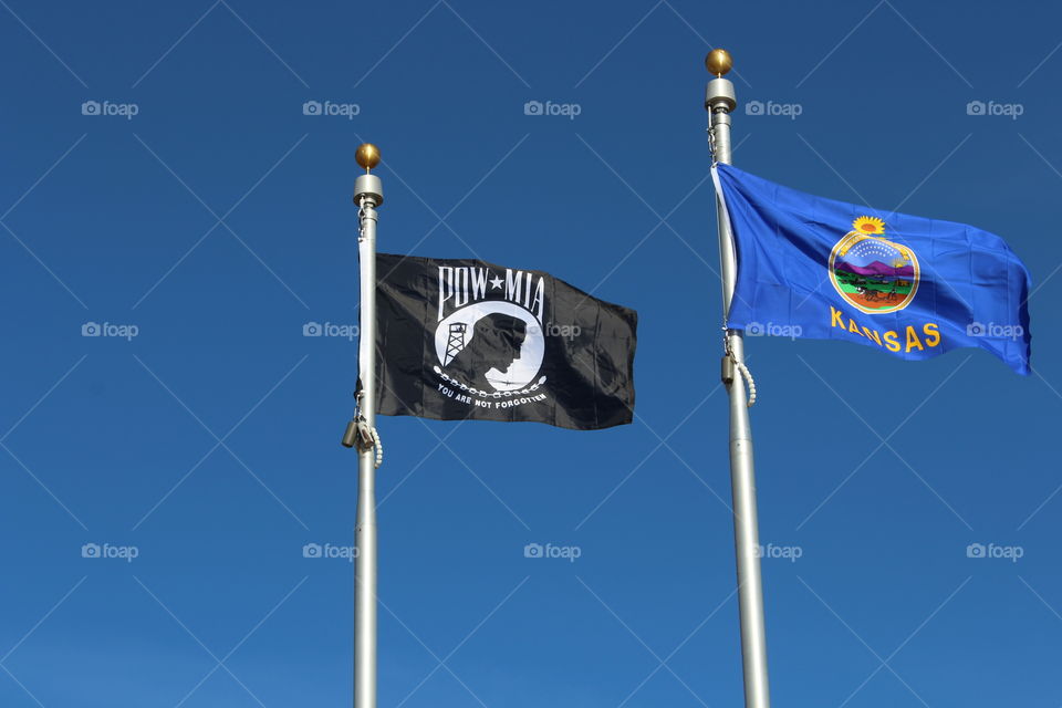 POW and MIA flag along with the Kansas State Flag