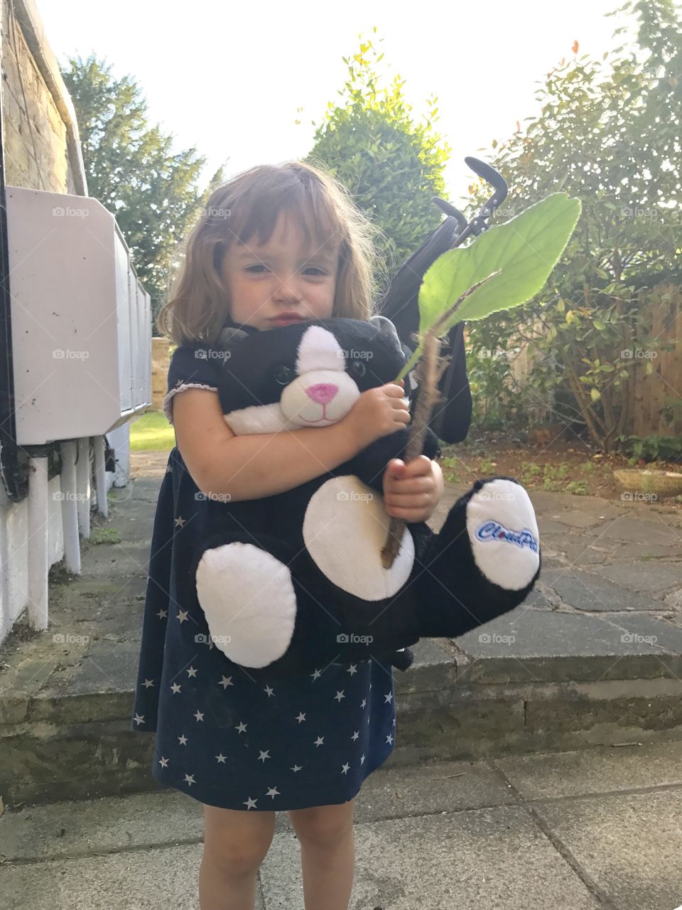 Little girl and soft toy 