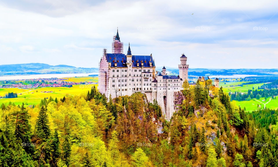 Ancient castle surrounded by autumn trees