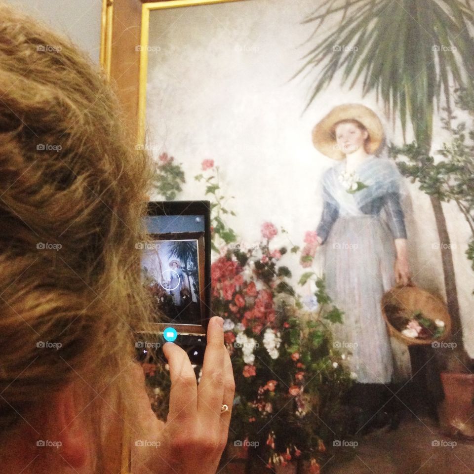 Taking a photo. Photo of a painting