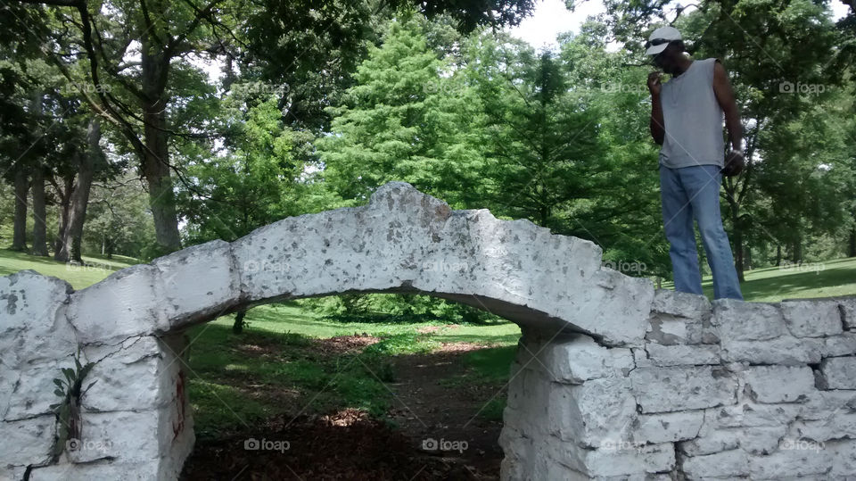 an interesting stone bridge in the park