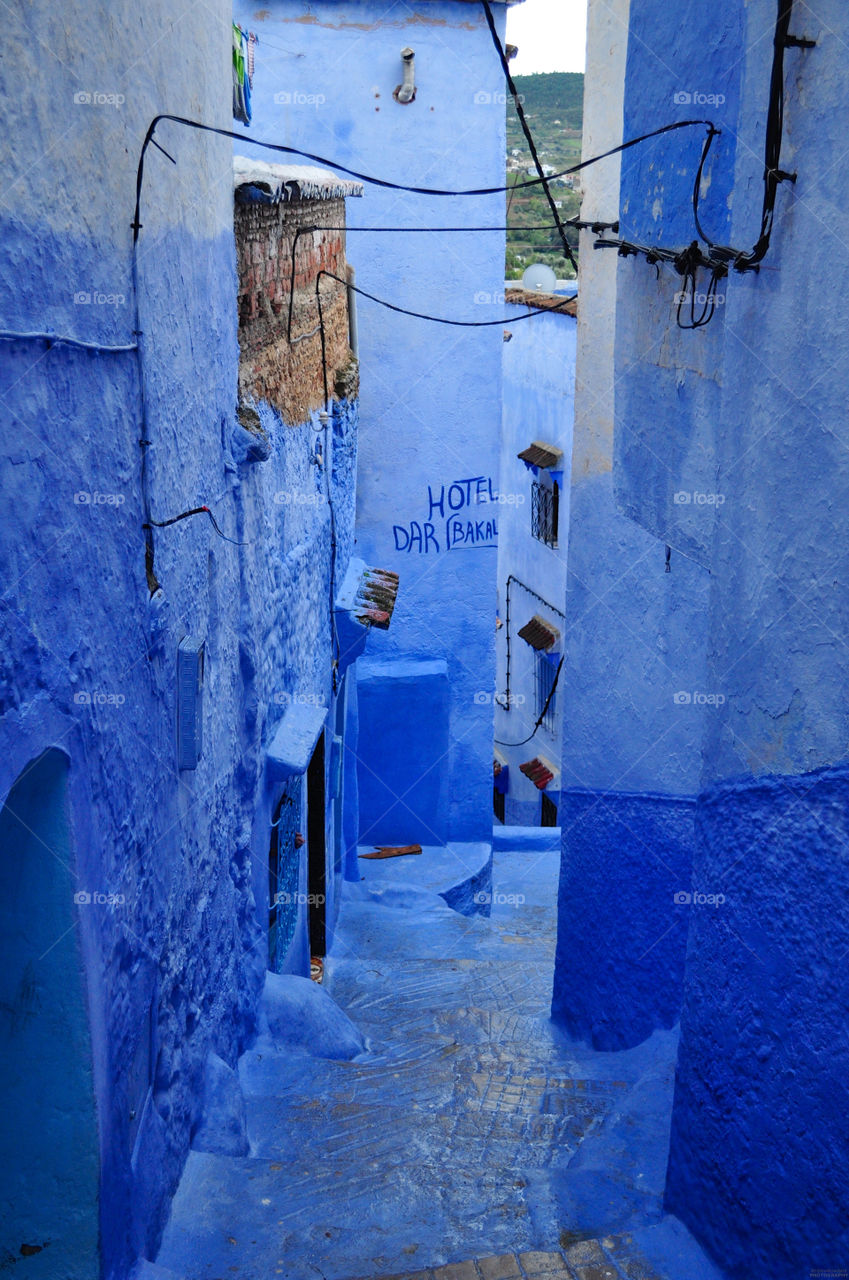 blue buildings steps old by scarecrow