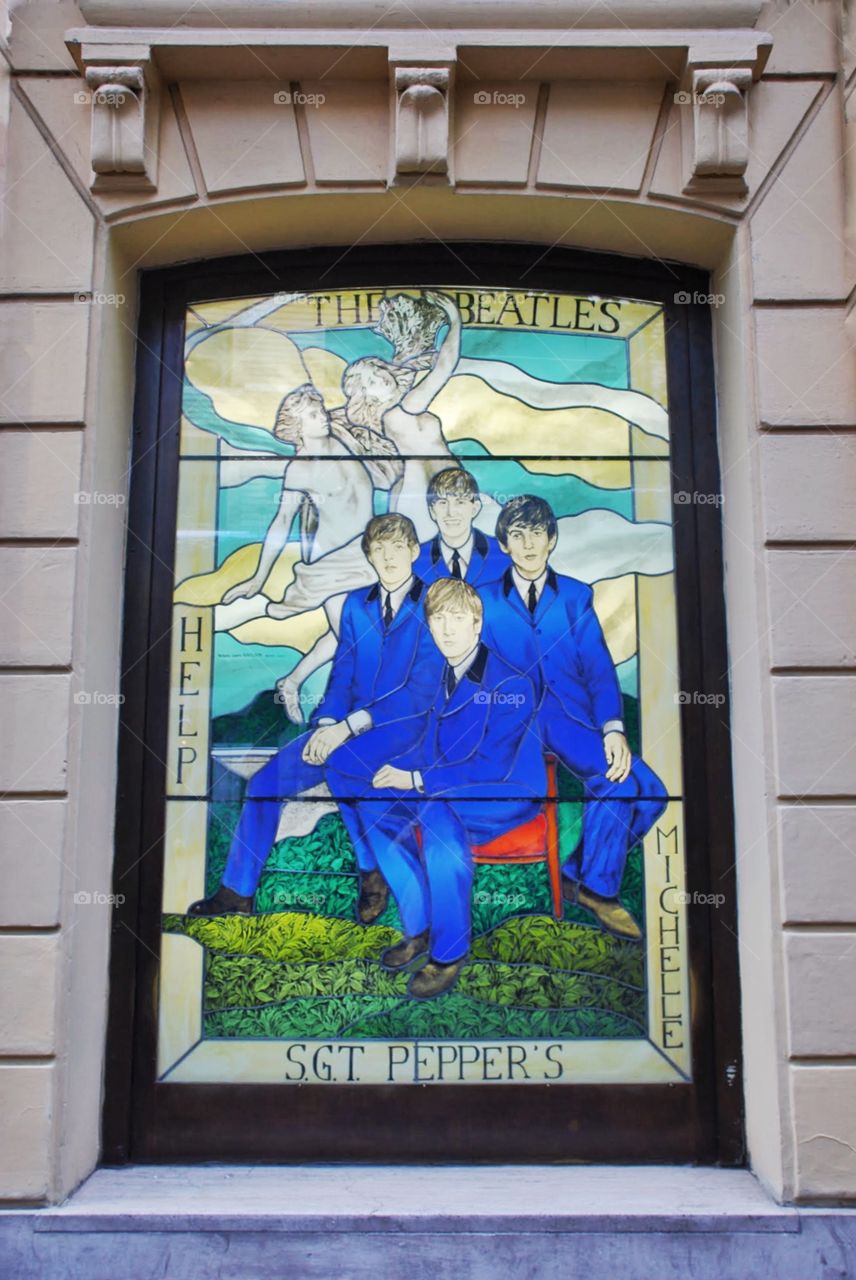 Stained glass window Beatles. Stained glass window of the early Beatles for the Rock and Roll Cafe on the exclusive Via Veneto in Rome, Italy