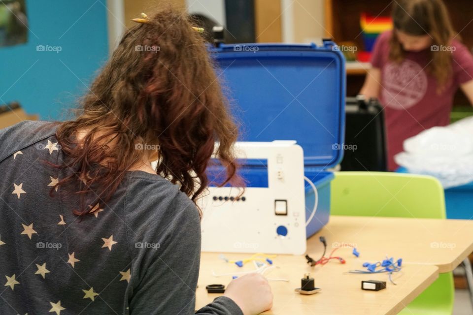 Girl Building A Circuitboard