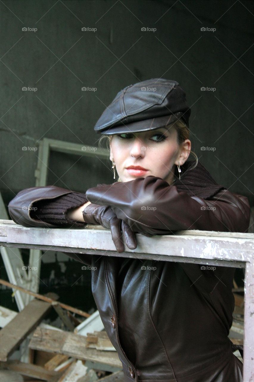 a girl poses in an abandoned building