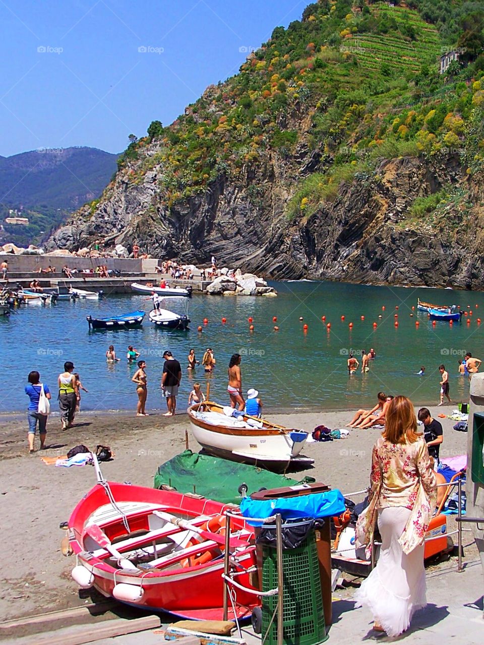 Sailing and summer fun at the beaches of Vernazza among the villages of Cinque Terra in Italy