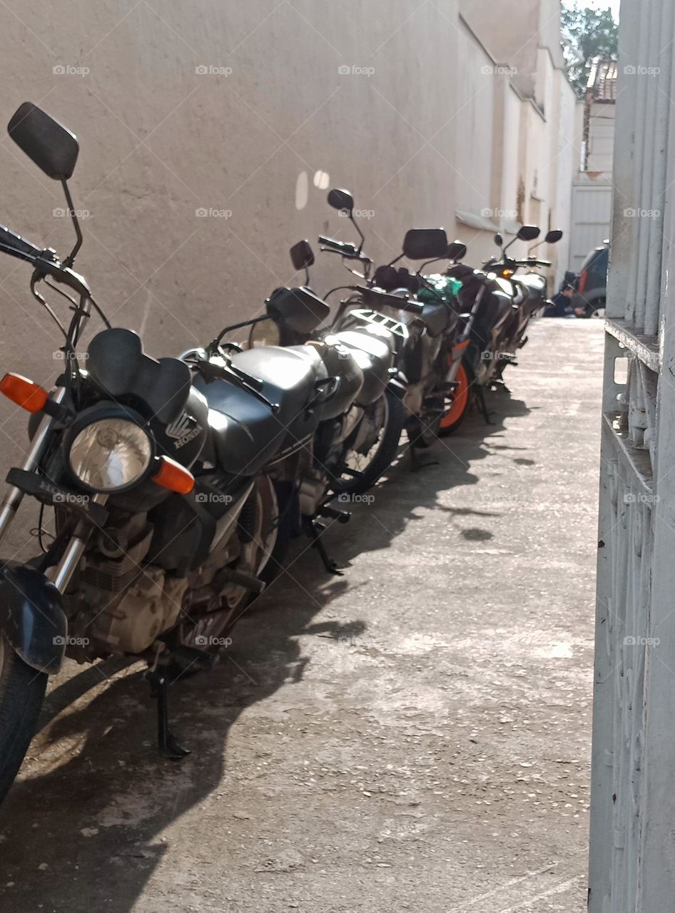 Motorbikes parked in an alley