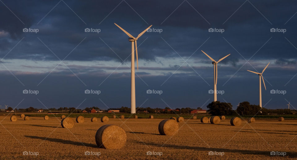 wind turbine hay sky blue by bradman