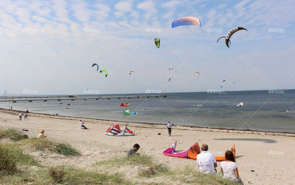 Watching kitesurfers in Malmö, Sweden.