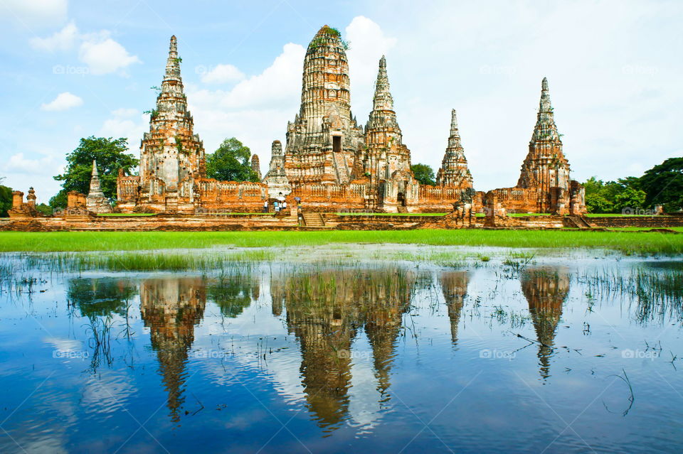 reflection after rain of ancient temple, chaiwatthanaram temple of thailand , travel in thailand