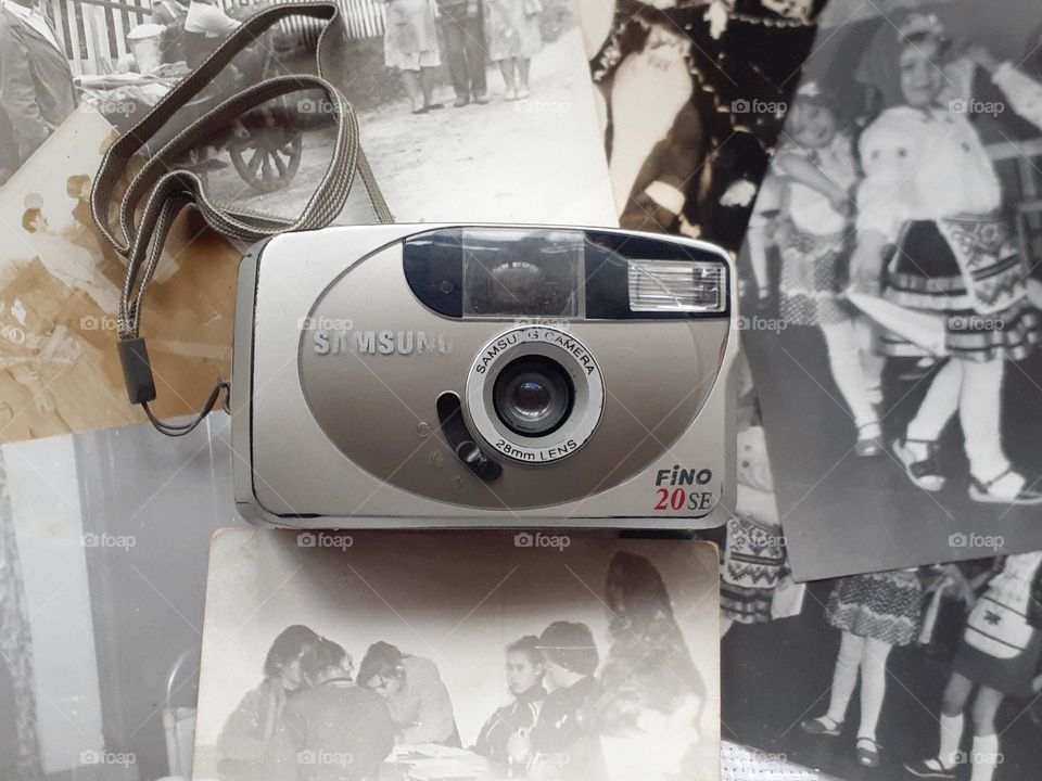 original photo retro film camera from the 2000s with old photos