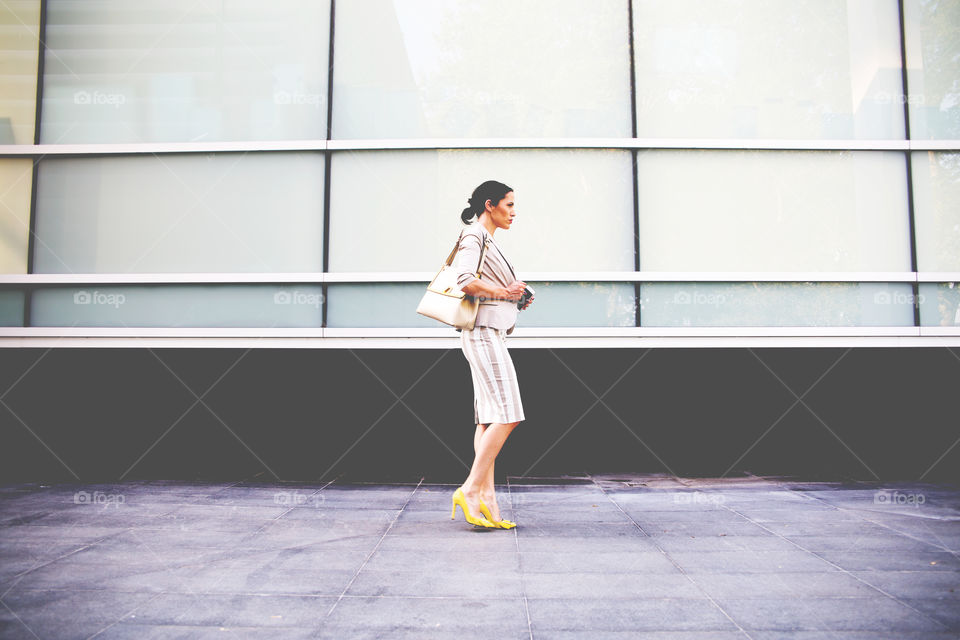Businesswoman walking on street