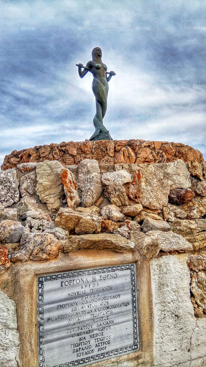 The statue of a mermaid in the port city of Astros,Greece
