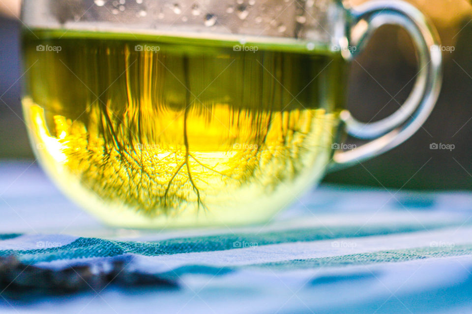Green tea in cup on table