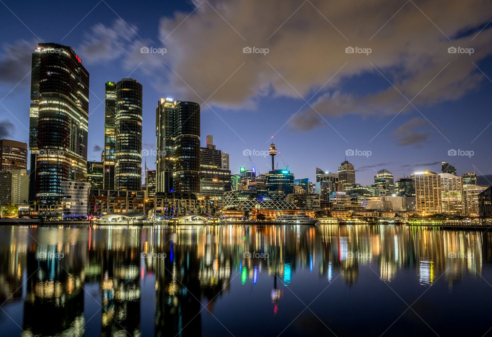 Dawn clouds above Sydney and Darling Harbour reflections 