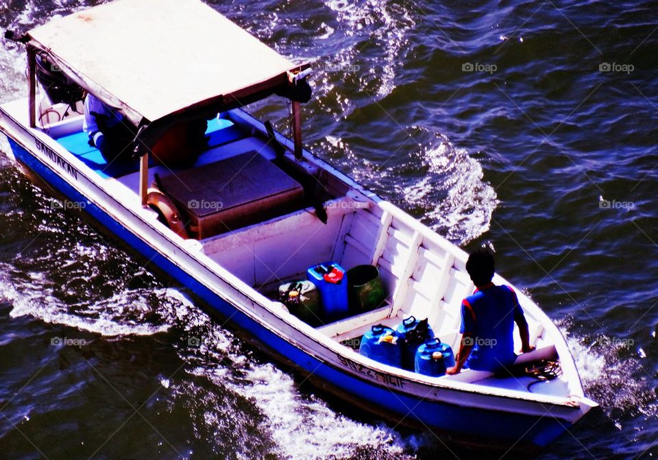 A fisherman in a boat