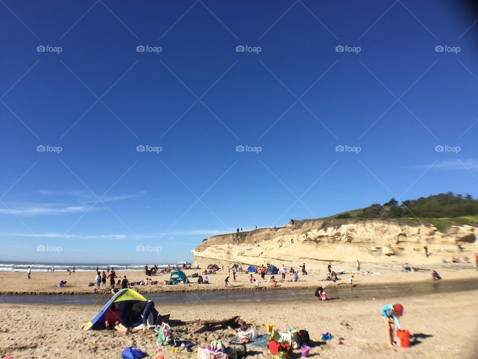 People enjoying the beach on a sunny day