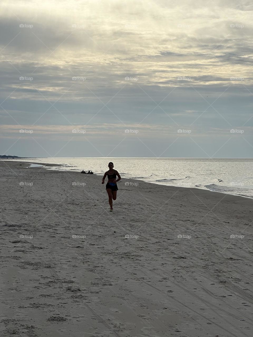 Woman running on the beach 