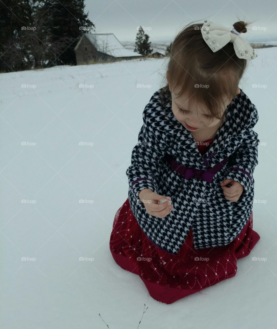 Cute girl playing in snow