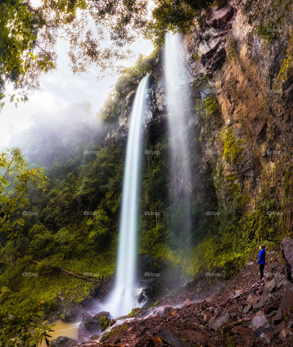 Person looking at the waterfall