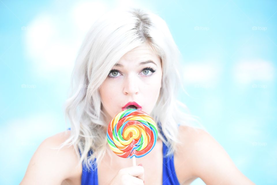 Blue lollipop lick bright colorful candy girl