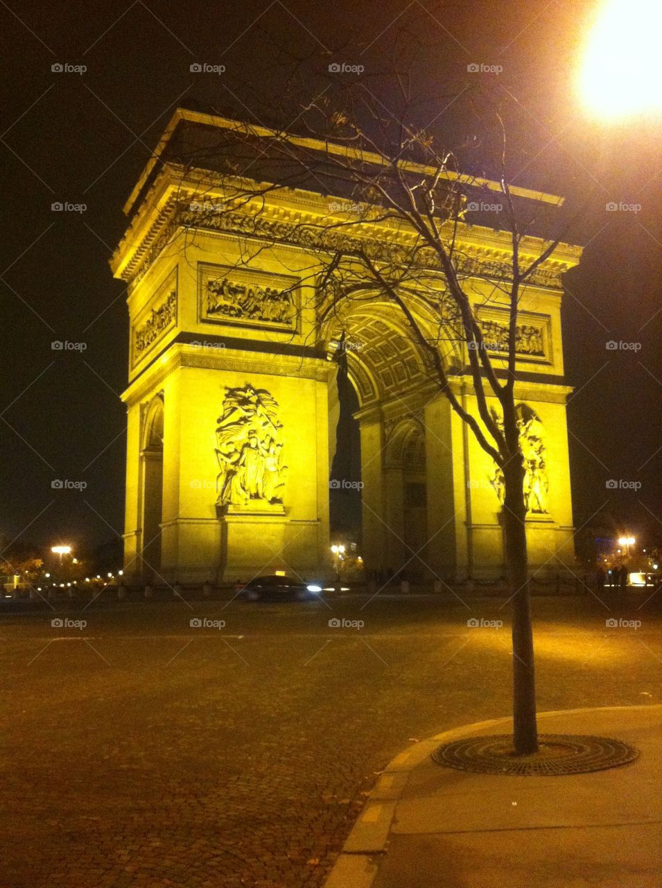 Arc de triomphe at night in Paris