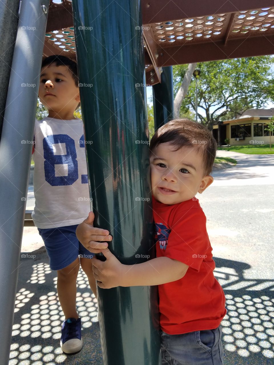 Little boy holding pole