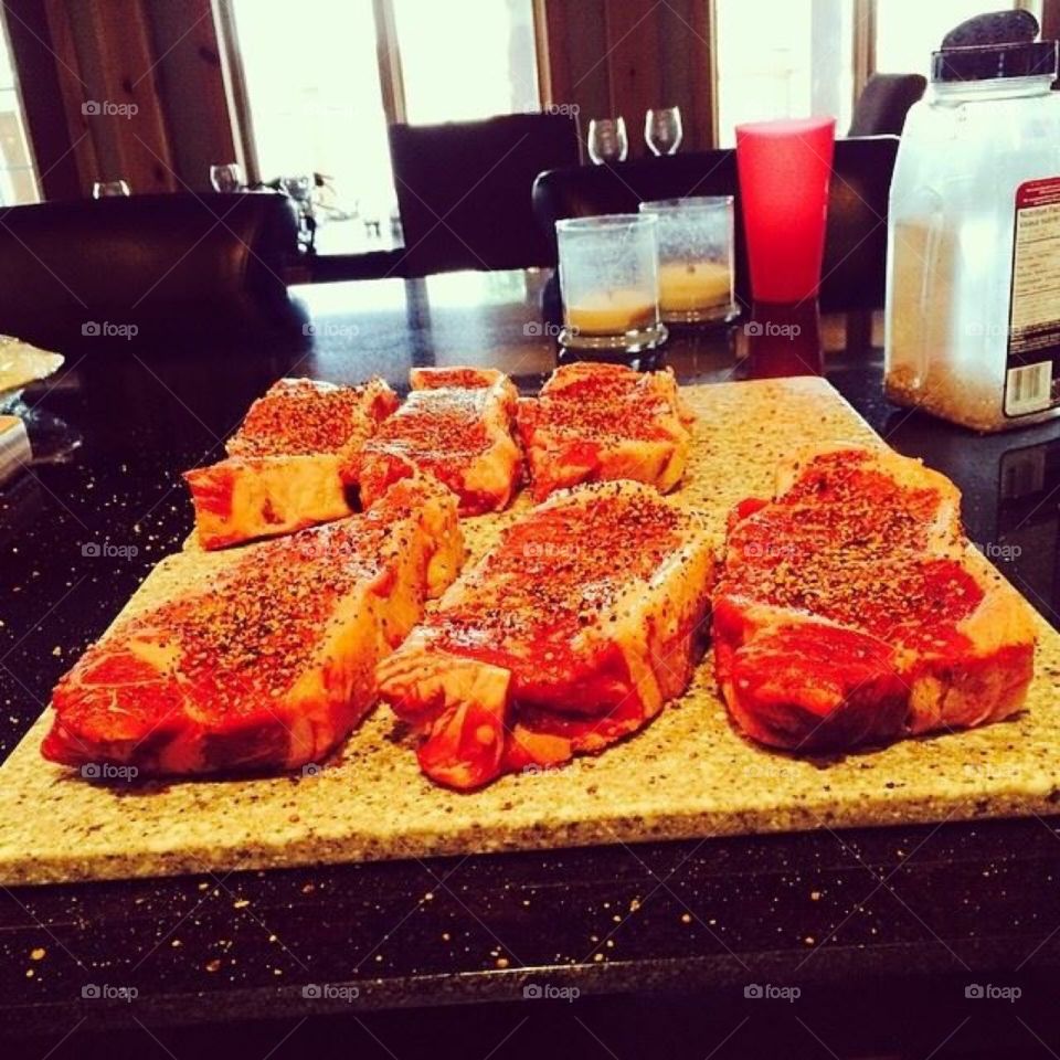 Raw seasoned steaks