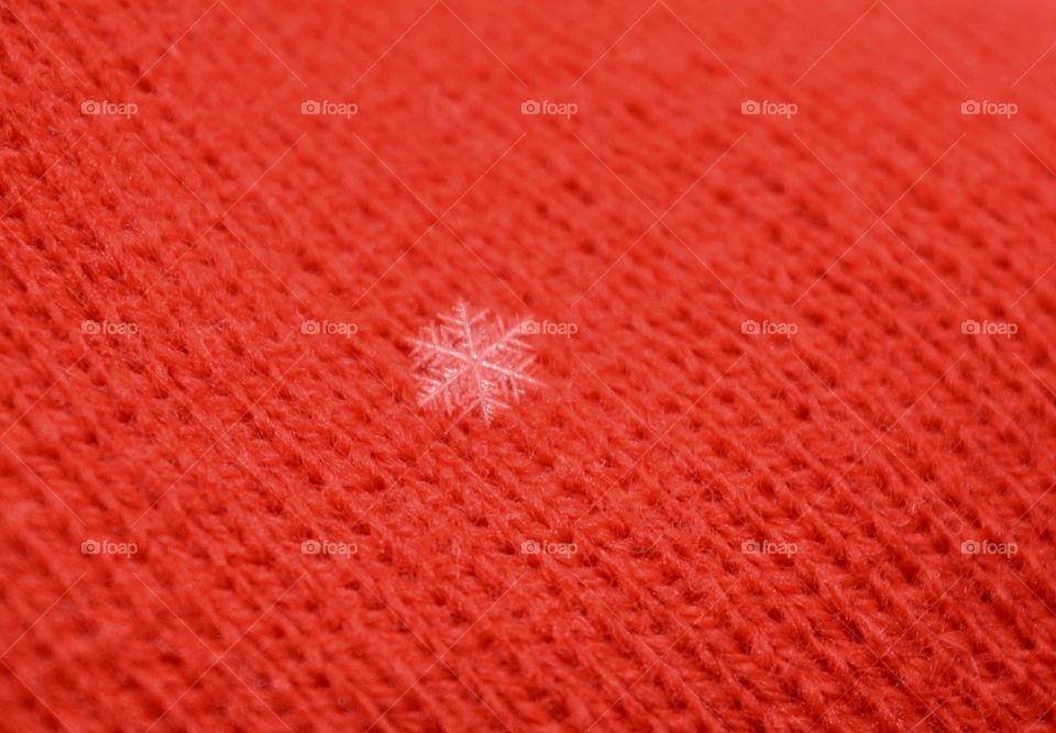 Snowflake on red background