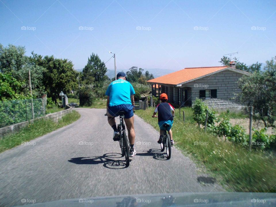 Sunday leisure time.. Father and son going on a bike ride... From A to B mission