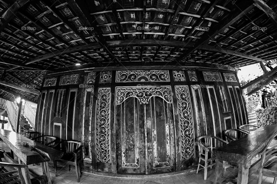 a door from a traditional javanese house with a thick traditional feel